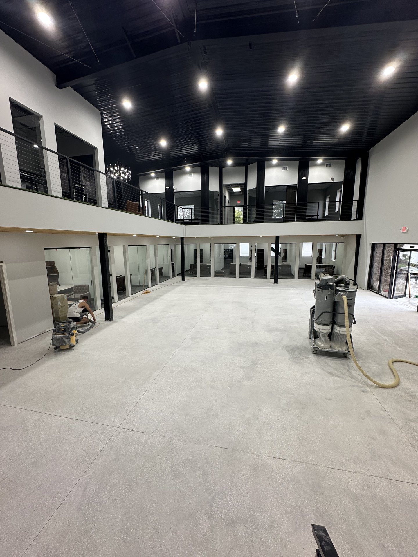 Two-story commercial buildout with full-height glass office partitions by BGM Jacksonville