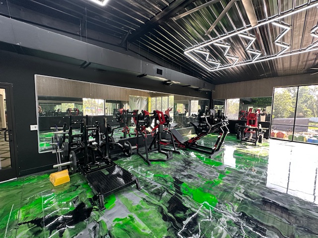 Strength-training floor reflected in custom gym mirror wall by BGM Jacksonville