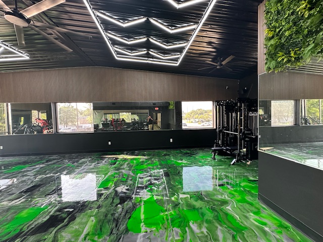 Wide commercial gym interior with full-length mirror walls by BGM Jacksonville