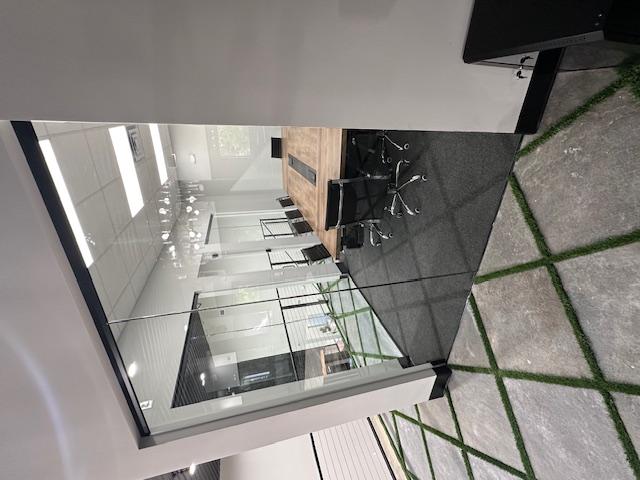 Interior glass conference room with frameless walls by BGM Jacksonville