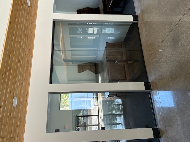 Frameless glass entry doors in commercial lobby by BGM Jacksonville