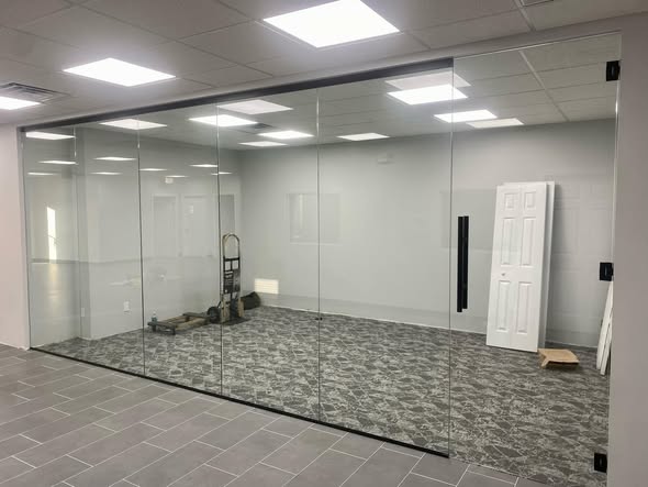 Glass conference room wall with custom handle by BGM