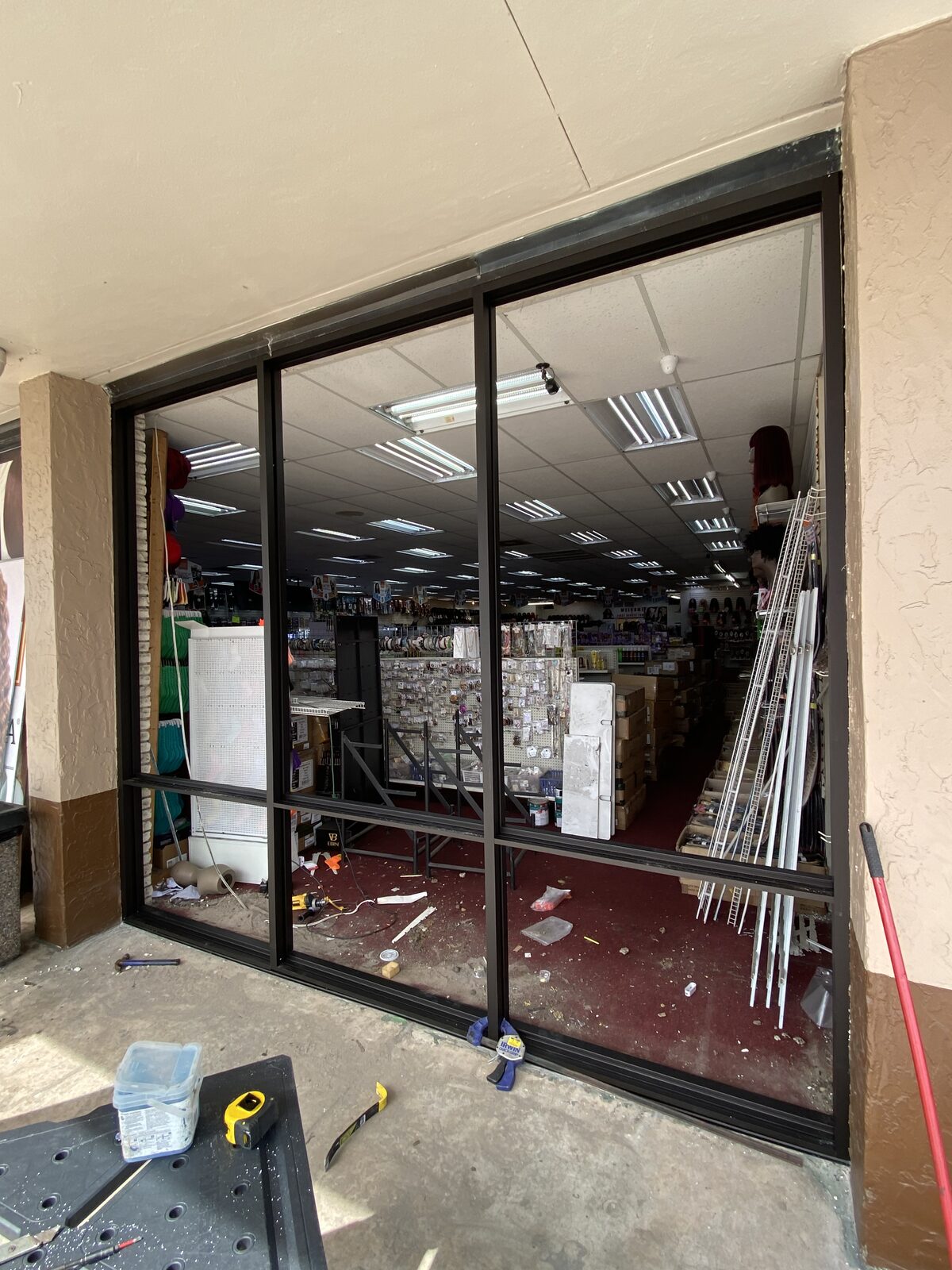 New black-framed commercial storefront glass installed by BGM Jacksonville