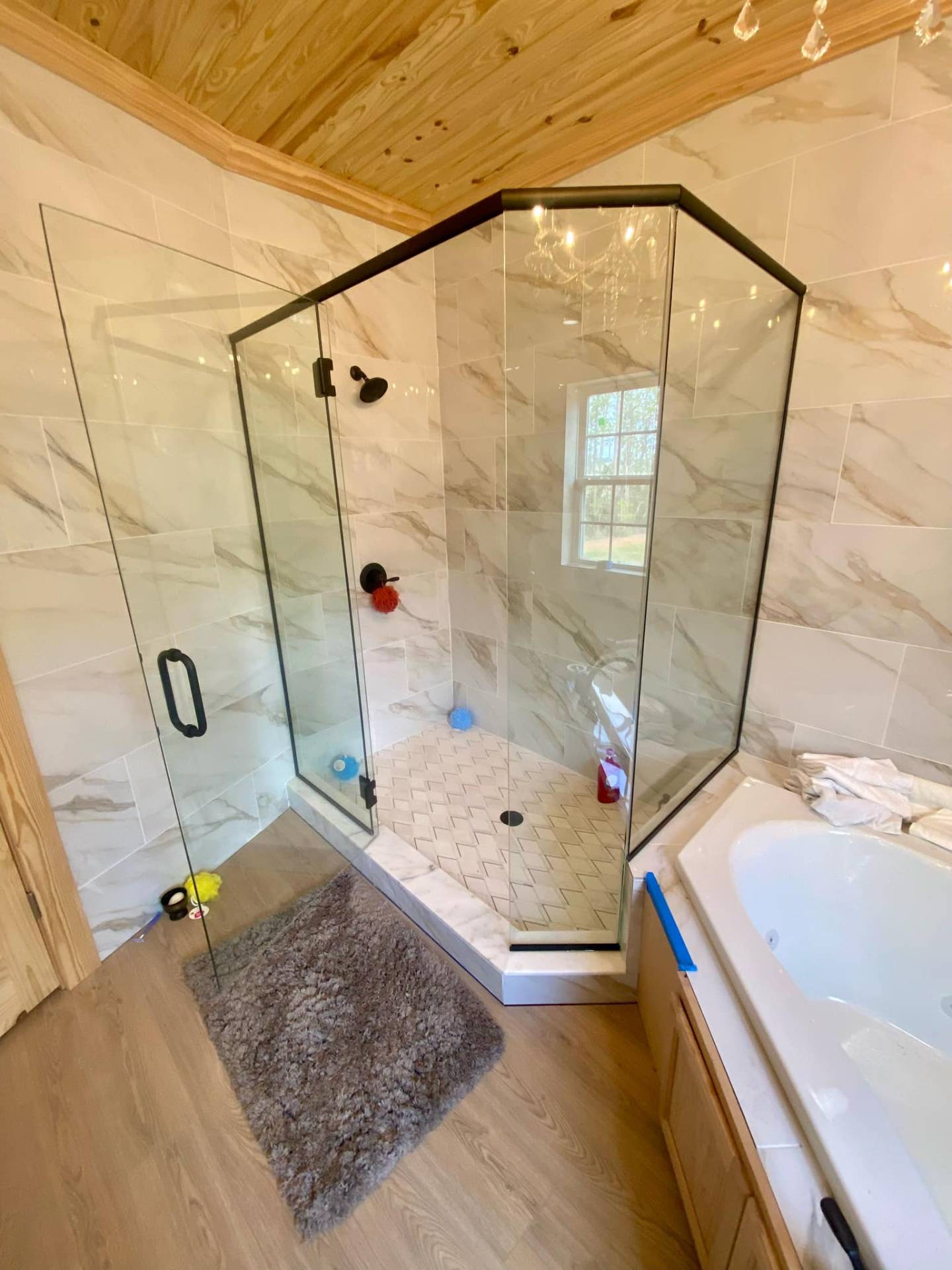 Custom frameless glass shower enclosure installed by Baum Glass & Mirror in a Jacksonville home